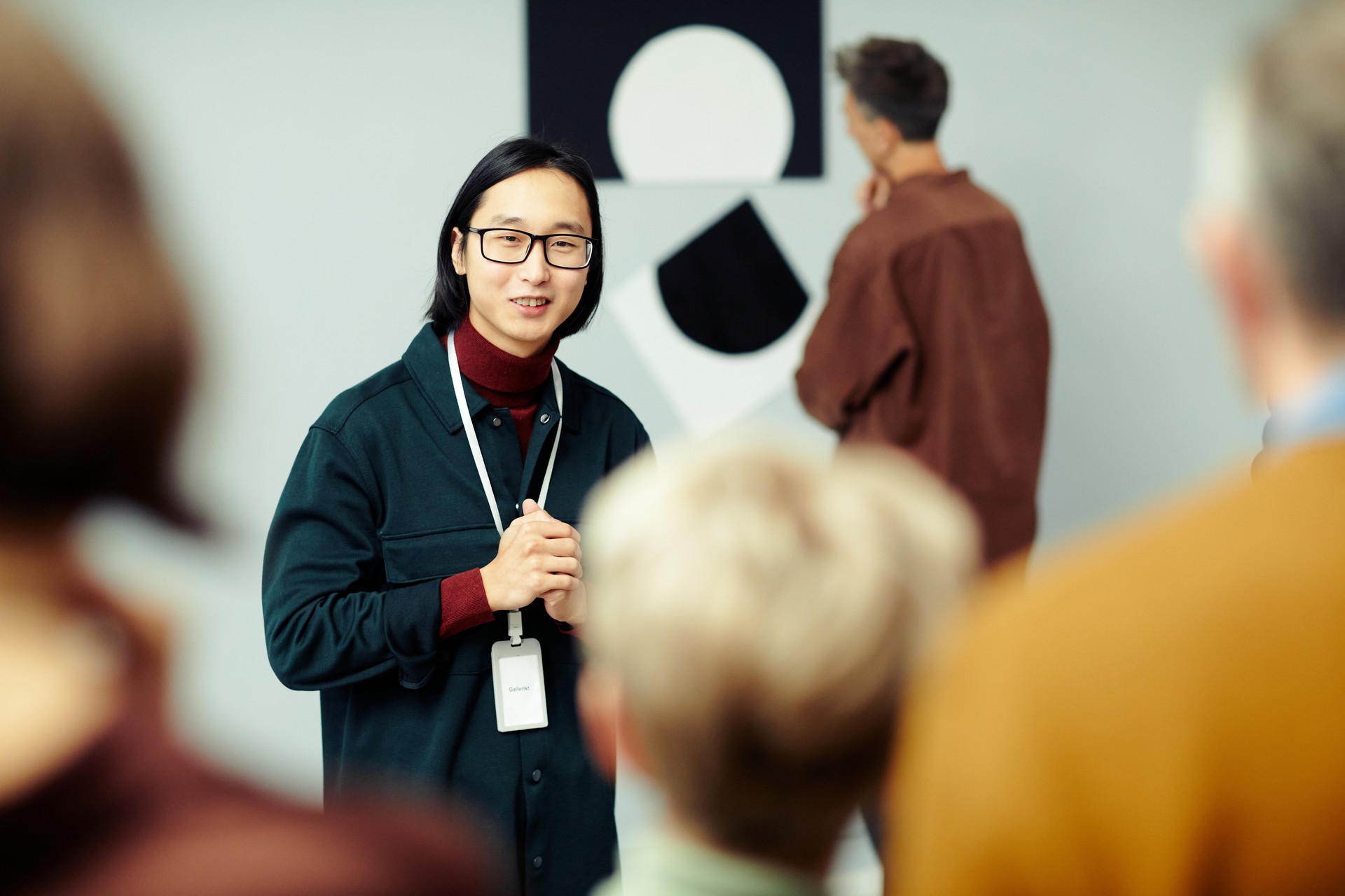 Young Man Giving Art Museum Tour