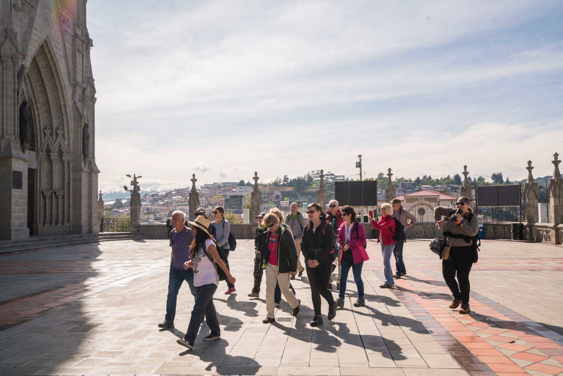 Guide with tourists in front of Basilica of the national vote in Quito, Ecuador.